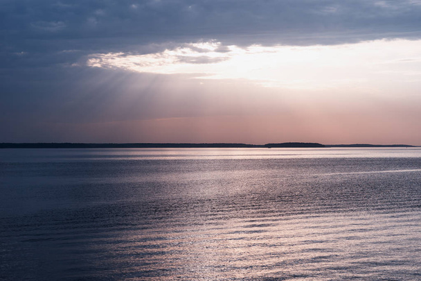 Sunset rays over the ocean landscape background - Fotografie, Obrázek