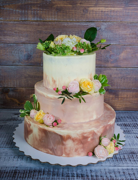 three-tiered wedding ombre cake decorated with roses and greener - Fotoğraf, Görsel