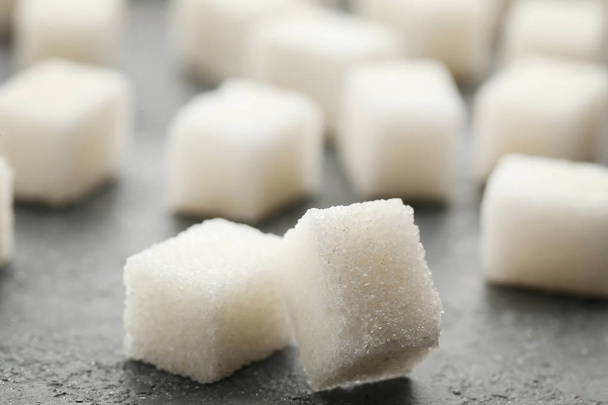 Sugar cubes on grey wooden table - Φωτογραφία, εικόνα