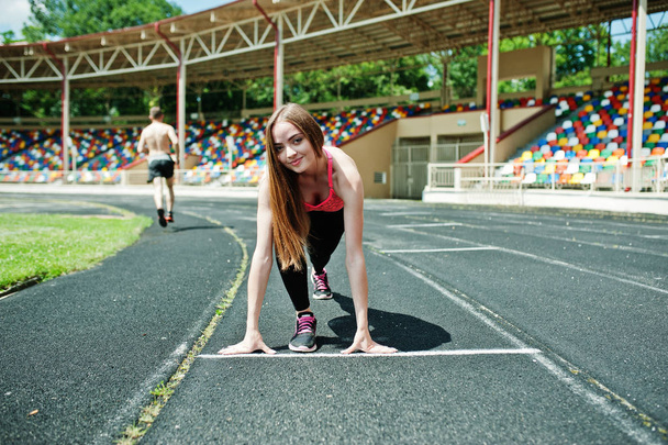 Fitness sporty girl in sportswear at stadium outdoor sports. Hap - Foto, Bild