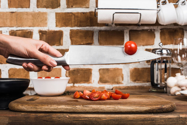cherry tomato on knife - Фото, изображение