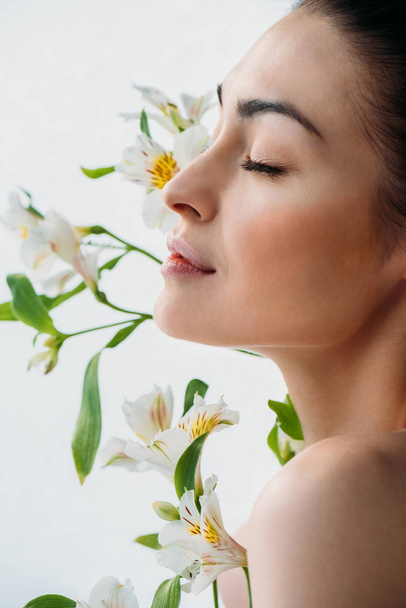 woman with natural makeup posing with lilies - Photo, Image