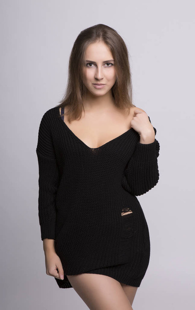 Oversize model posing in black sweater - Foto, Bild