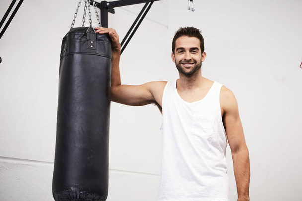 Boxer dude with punch bag  - Φωτογραφία, εικόνα