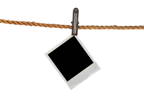 Old photo on a rope isolated on a white background - Photo, Image