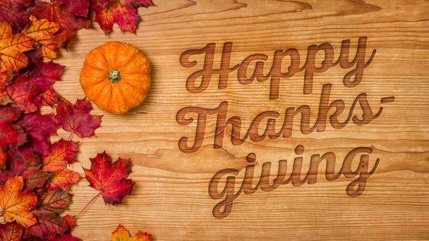A wooden background with autumn foliage - Happy Thanksgiving - Photo, Image
