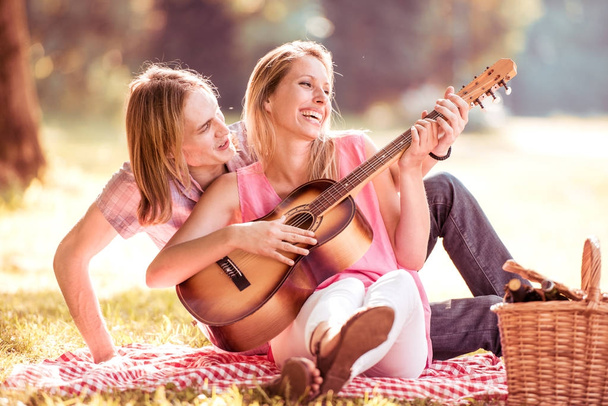 Couple playing guitar - Photo, Image