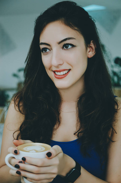 Smiling girl in a cafe. - Fotó, kép