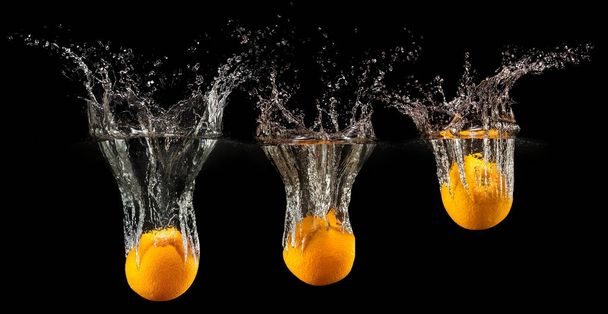 Group of fresh fruits falling in water - Фото, изображение