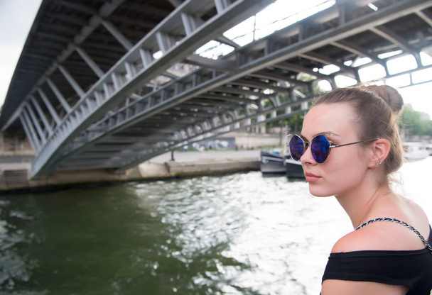 Woman under bridge in Paris, France - Fotografie, Obrázek