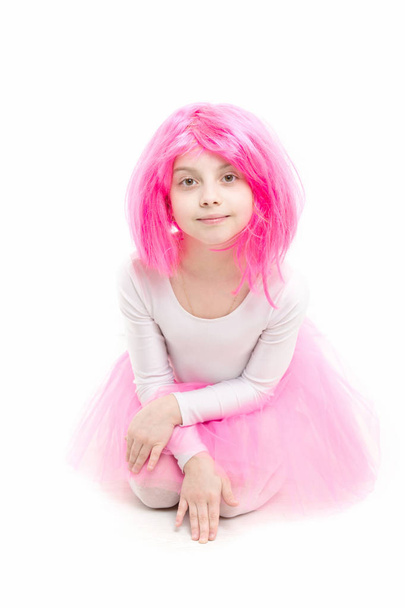 Childhood and happiness. Child in wig isolated on white background. Small girl t in pink skirt. ballet and art. beauty and fashion. - Photo, Image