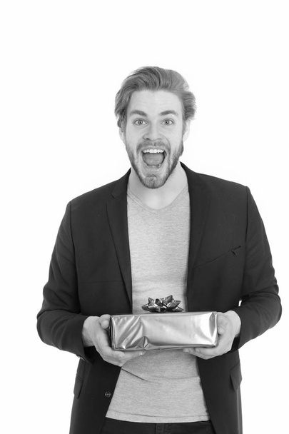 handsome happy businessman holding blue gift box - Zdjęcie, obraz