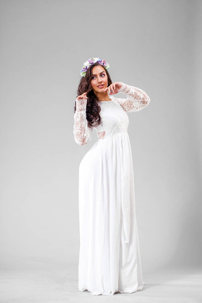 Young arabic woman in white sexy dress - Фото, зображення