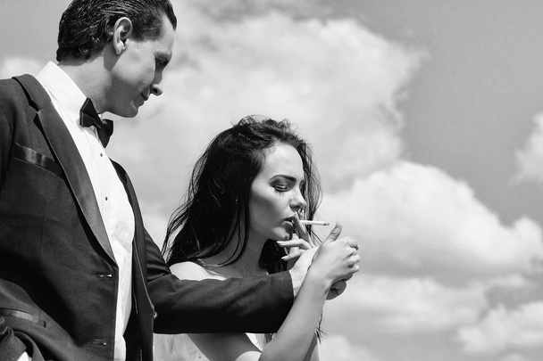 Beautiful woman smoking cigarette - Fotó, kép