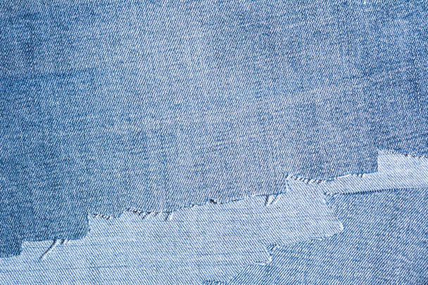 shreds of denim fabric, unevenly cut jeans - 写真・画像