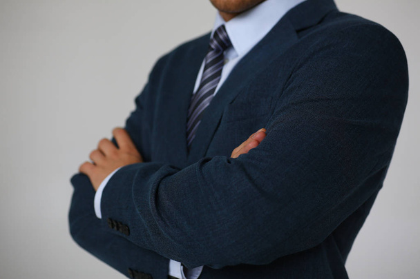 Male hands in suit crossed on chest closeup - Φωτογραφία, εικόνα