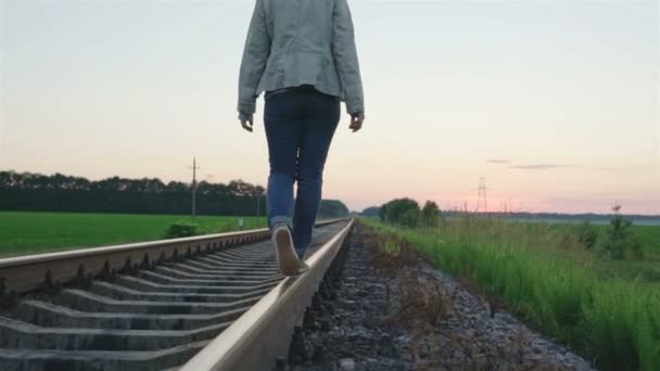 Girl walking on the railway track - Footage, Video