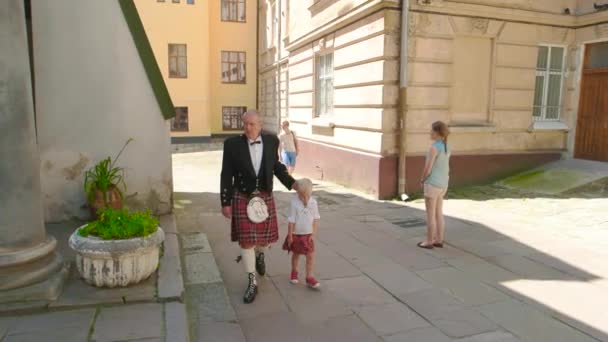 Scottish man with his son. - Video