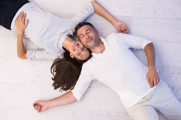handsome couple lying on floor - Foto, immagini