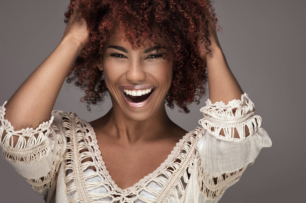 Beauty portrait of smiling girl with afro hairstyle. - Fotografie, Obrázek