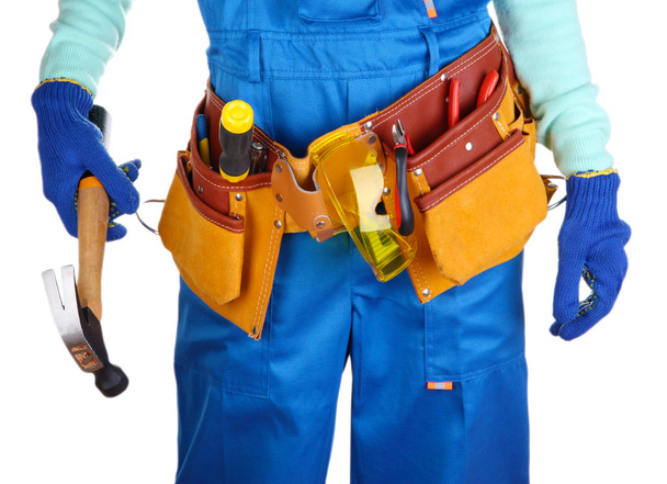 Male builder in blue overalls with gavel isolated on white - Fotografie, Obrázek