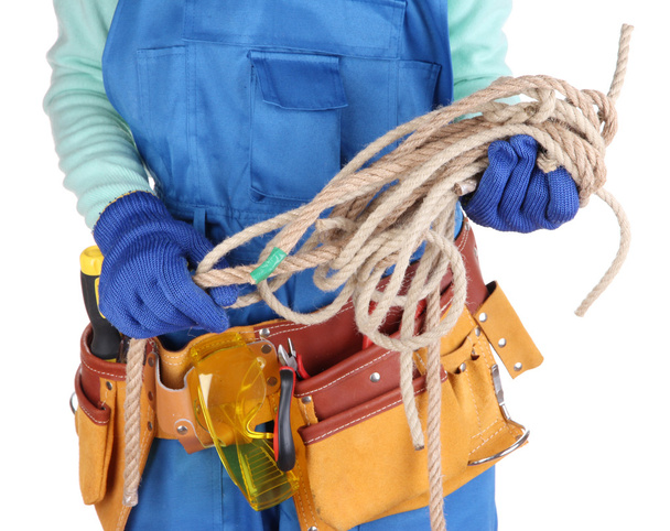 Male builder in blue overalls with rope isolated on white - Foto, imagen