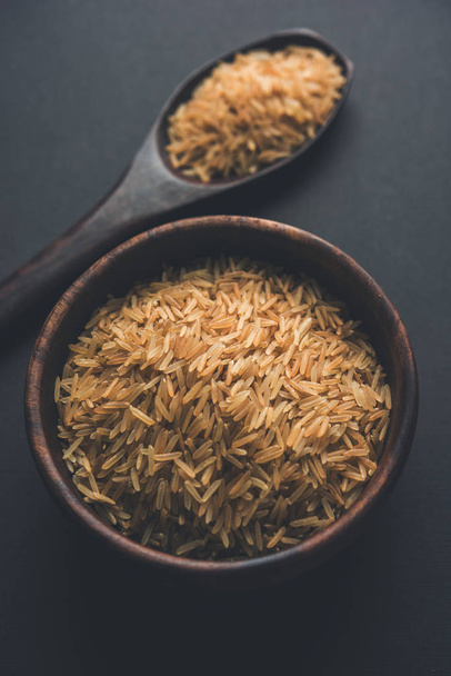 Stock photo of Brown basmati rice in raw form, selective focus - Fotó, kép