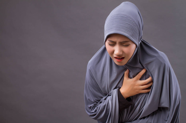sick muslim suffering from heart attack, seizure - Photo, Image