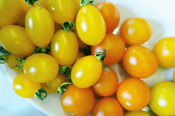 Yellow and orange cherry tomatoes - Fotoğraf, Görsel