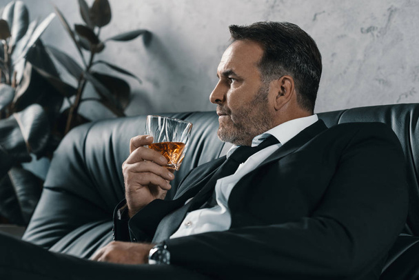 businessman with glass of whiskey - Zdjęcie, obraz