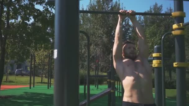 Muscular Athlete Working Out In An Outdoor Gym - Video