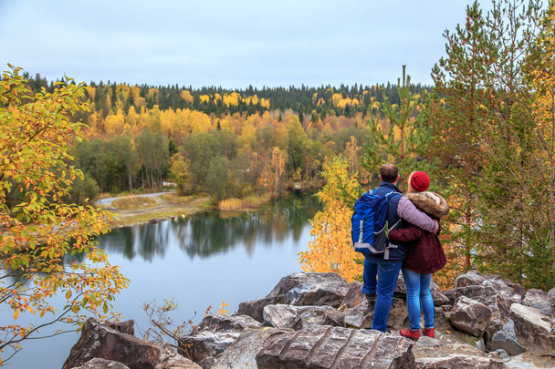 Family travelers looking at a mountain lake in Marble Canyon.  - 写真・画像