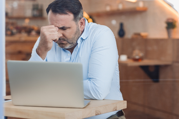 depressed businessman with laptop - Photo, Image