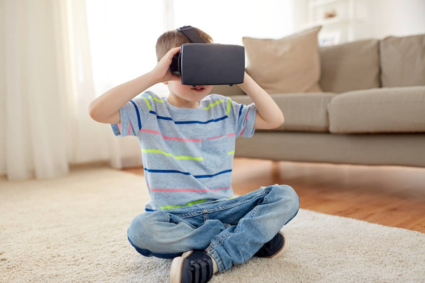 little boy in vr headset or 3d glasses at home - Photo, Image