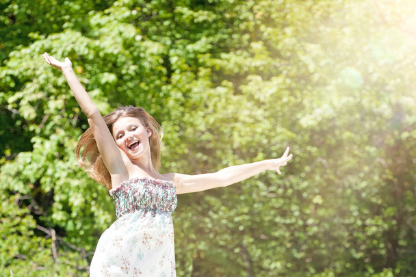 Happy Young Woman Enjoying Summer on the Green Meadow. - Fotografie, Obrázek