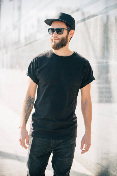 Hipster handsome male model with beard  wearing black blank  t-s - Fotó, kép