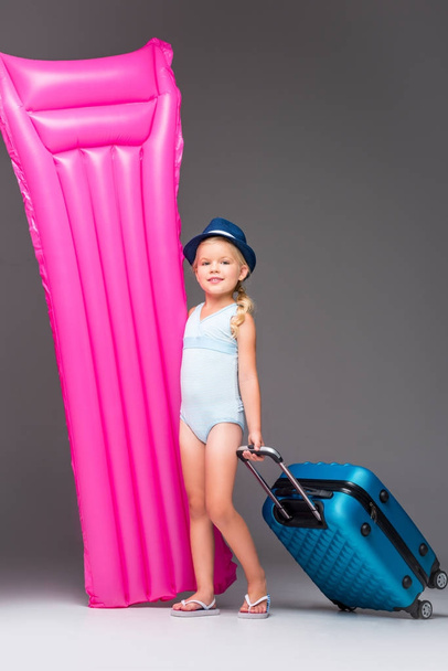 child with suitcase and swimming mattress - Φωτογραφία, εικόνα