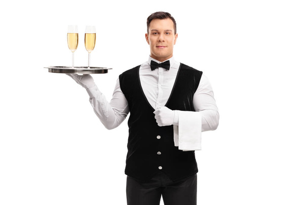 офіціант тримає піднос в келихах вина
 - Фото, зображення