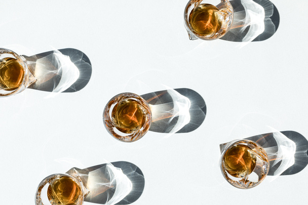 whiskey in glasses with shadows      - Фото, зображення