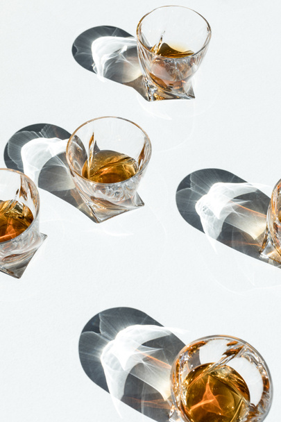 whiskey in glasses with shadows  - Photo, Image