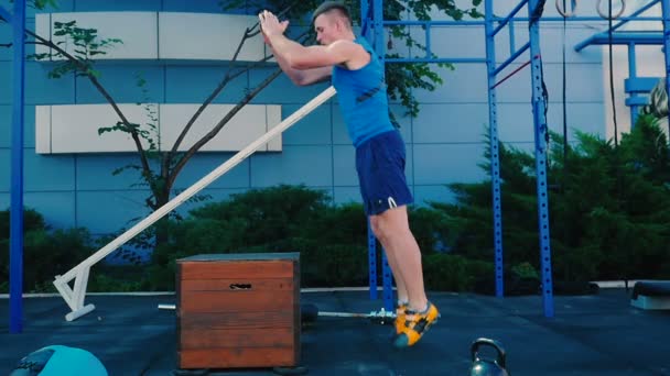muscular man jumping outdoor  - 映像、動画
