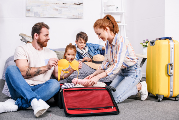 family packing luggage for trip - Foto, imagen