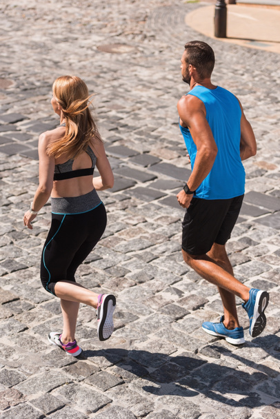 sport couple jogging in city - Photo, Image
