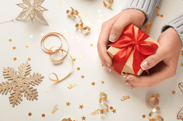 Female hands with small gift box  - 写真・画像