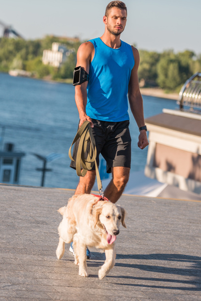 sportsman walking with dog - Photo, Image