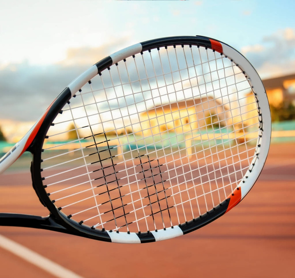 Tennis racket and court on background - Photo, image