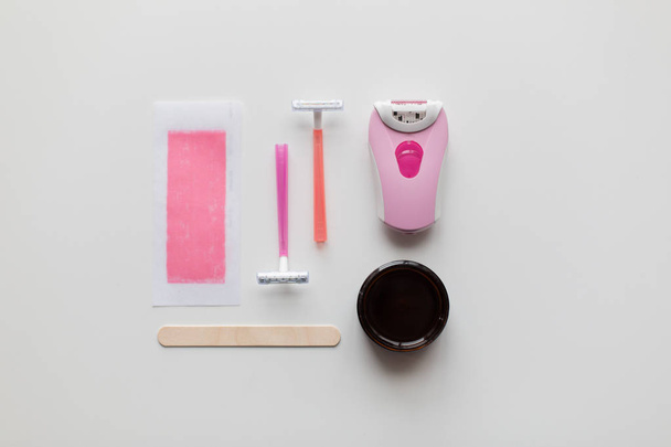 hair removal wax, epilator and safety razor - Fotoğraf, Görsel
