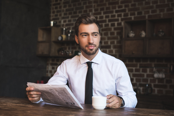 businessman at cafe with newspaper - Photo, Image