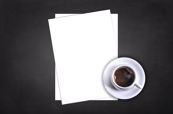 Blank letterhead and coffee cup on black table background. - Фото, изображение