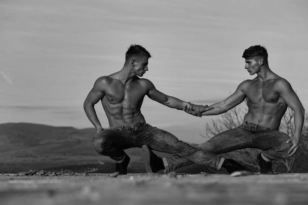 Twin men or bodybuilders wrestling - Zdjęcie, obraz